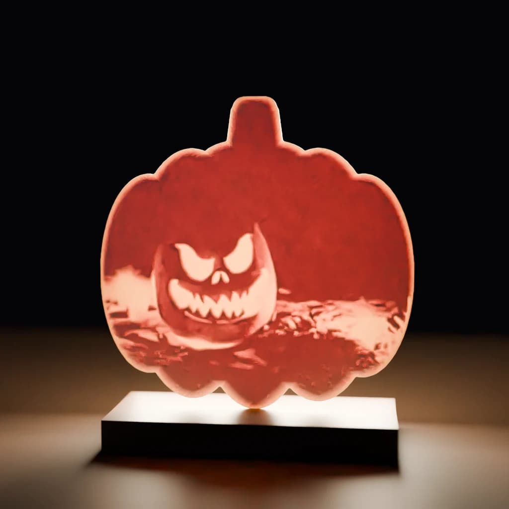 A render of a pumpkin-shaped photo panel glowing from behind