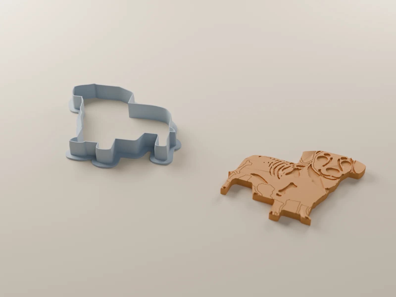 A render of the dog cutter beside the cookie it cuts, skeleton lines pressed in
